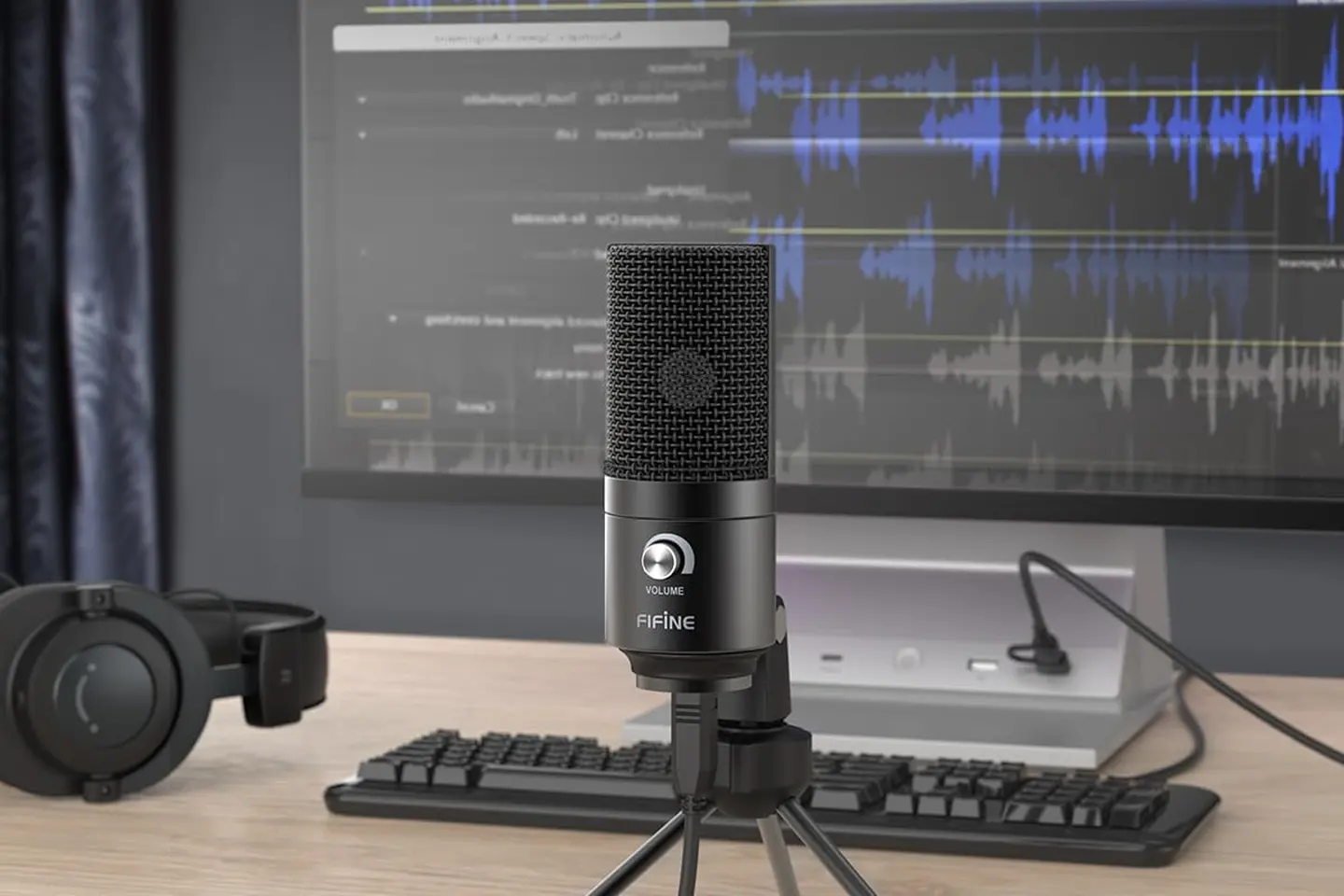 FIFINE K669B set up on a desk beside a computer display