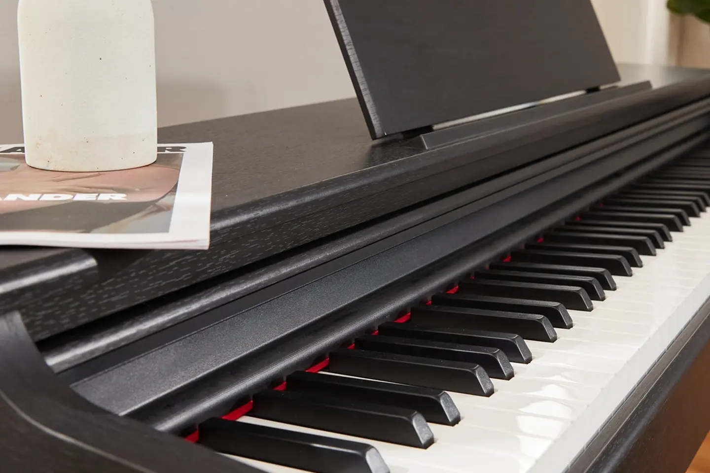 Close view of the weighted keys and music rest on the Donner DDP-100